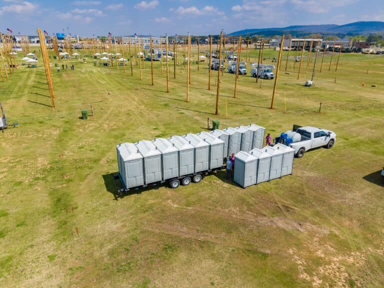 Portable restrooms for a festival staged in a bank on an open event field in Alabama